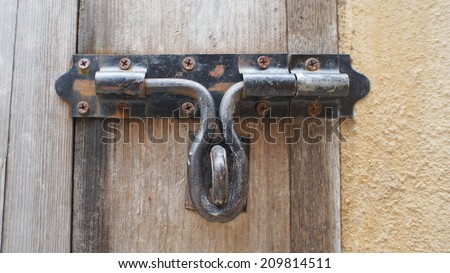 Metal door lock on wood door