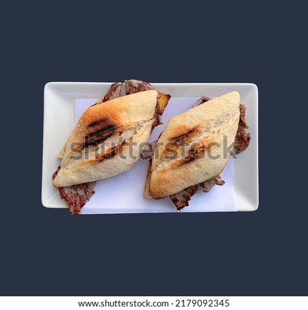 Veal nugget is a hot sandwich originally from Spain that is usually made with French bread and grilled or fried beef in oil with some laminated garlic. Imagine de stoc © 
