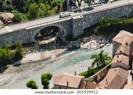 Aerial view of river and bridge in french town Entrevaux.