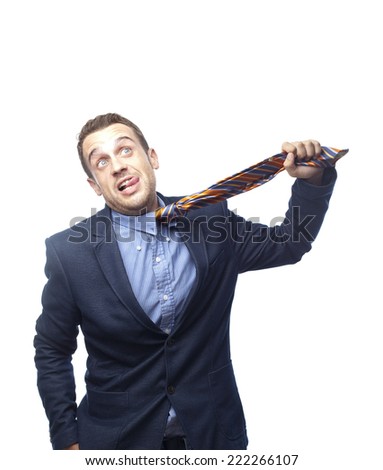 Man in suit by jumping tie