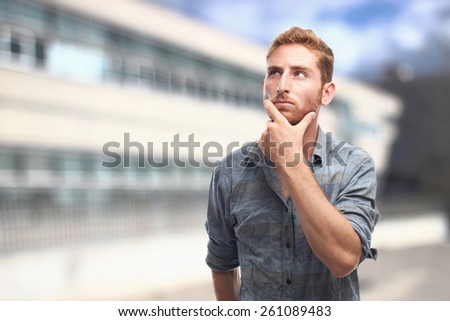 ginger young man with shirt imagining
