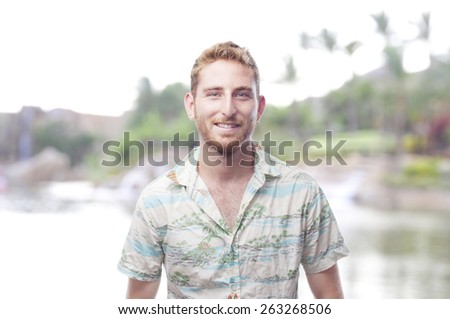 ginger young man with hawaiian shirt smiling