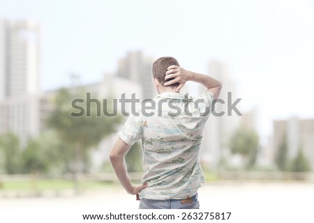 ginger young man back looking at something