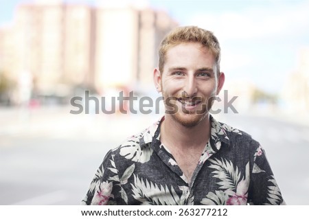 ginger young man with hawaiian shirt happiness