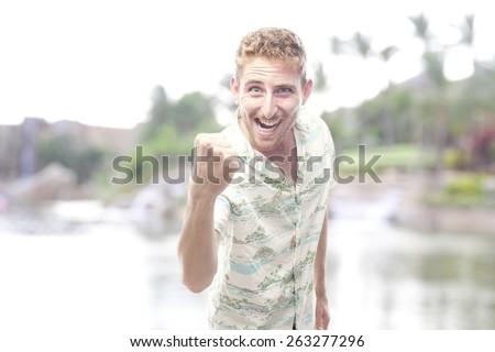 comical ginger young man with hawaiian shirt