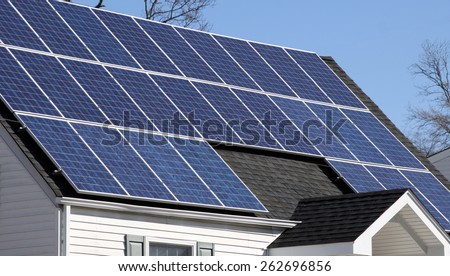 solar panels on roof of home in sunlight