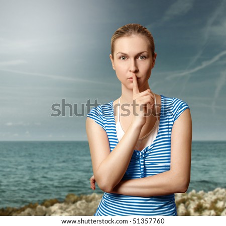 Sporty women with finger near mouth