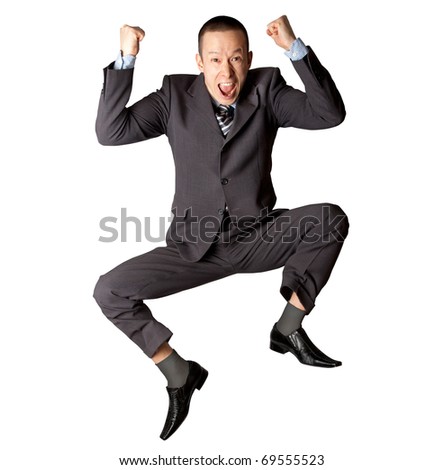 Happy businessman jumping in air isolated on white background