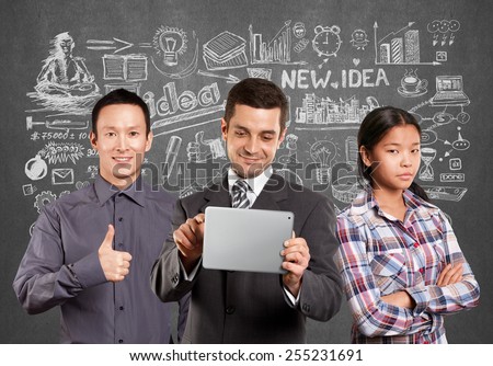 Team and man businessman in suit with touch pad in his hands