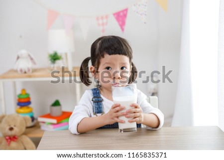 Similar – Image, Stock Photo Newborn drinking milk from a baby bottle, sitting on mom legs outdoors