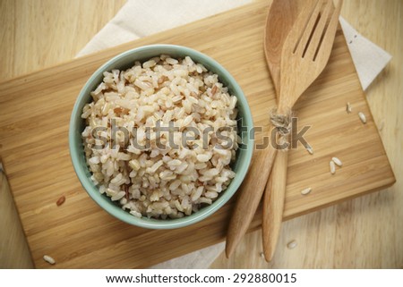 Brown Rice on Wooden Plate
