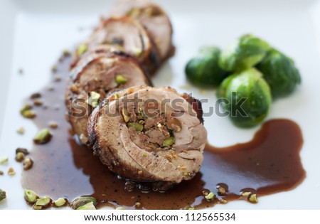 Bacon wrapped chicken thigh stuffed with wine sauce and brussel sprouts