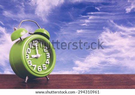 Clock on Wooden Floor with Blue Sky Background , Vintage Style