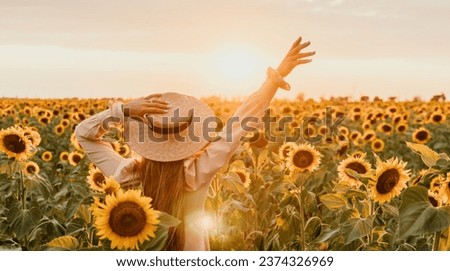 Similar – Foto Bild chica sujetando girasoles en el balcon