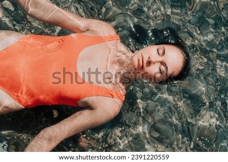 Similar – Image, Stock Photo Caucasian lady floating in turquoise sea.
