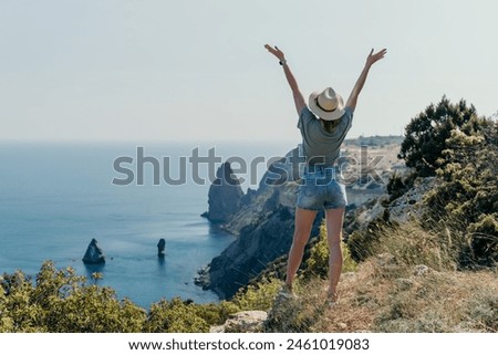 Similar – Image, Stock Photo Female tourist at wild rocky beach and coastline of surf spot La Santa Lanzarote, Canary Islands, Spain. La Santa village and volcano mountain in background