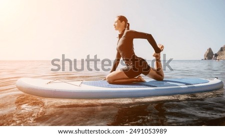 Similar – Image, Stock Photo Serene woman on surfboard in sea