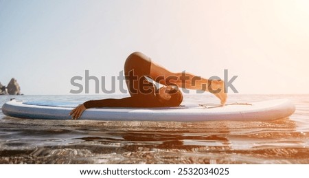 Similar – Image, Stock Photo Woman practicing on paddleboard in sea