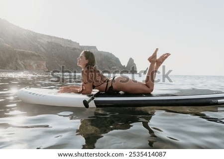 Similar – Image, Stock Photo Calm sea near rocky shore with buildings