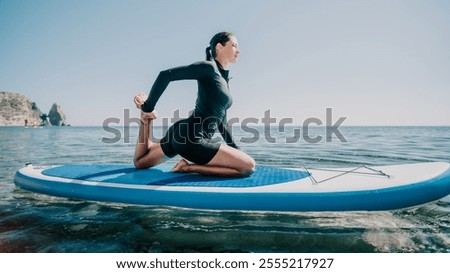 Similar – Image, Stock Photo Woman practicing on paddleboard in sea