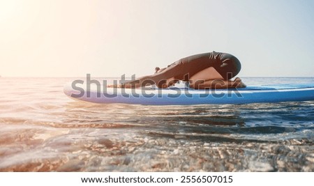 Similar – Image, Stock Photo Woman practicing on paddleboard in sea