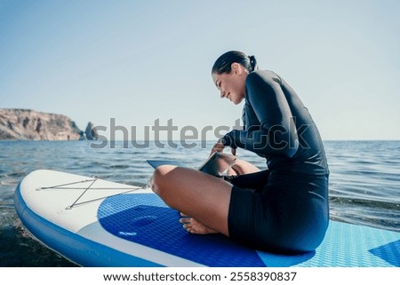 Similar – Image, Stock Photo Woman with paddleboard on shore in sea