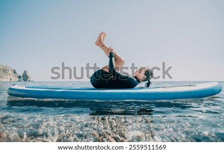 Similar – Image, Stock Photo Woman practicing on paddleboard in sea