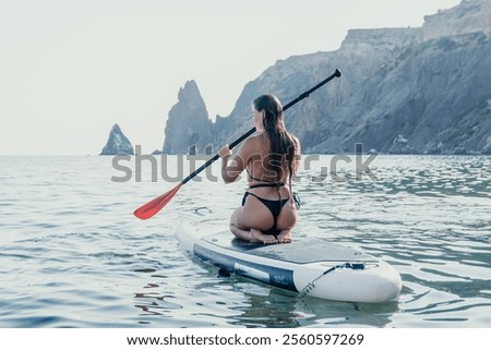 Similar – Image, Stock Photo Calm sea near rocky shore with buildings