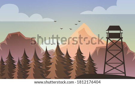 Morning view of the autumn forest landscape. Sunrise and view of the forest rescuer's observation tower.