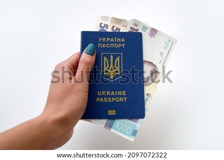 New banknotes in denominations of 500 and 1000 hryvnia with a Ukrainian passport. Ukrainian money. Business concept. Background with hryvnia. Сток-фото © 