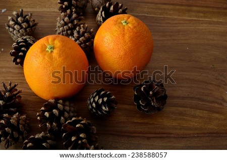 orange with pine cone