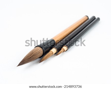 Three chinese brushes on white background