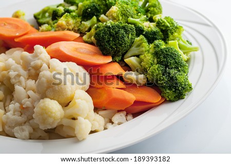 cooked vegetables: cauliflower, carrot and broccoli.