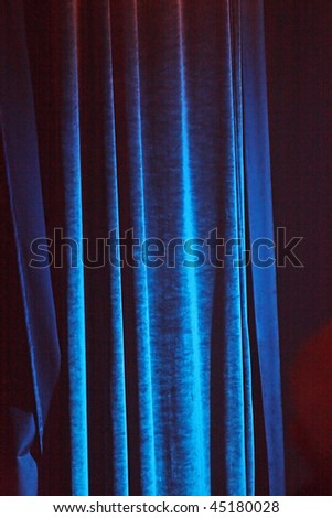 Heavy light blue curtain before the performance