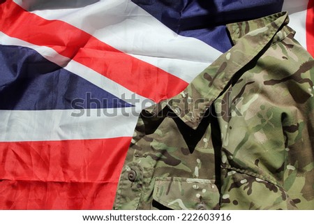 UK flag and military uniform depicting the military, war and conflict