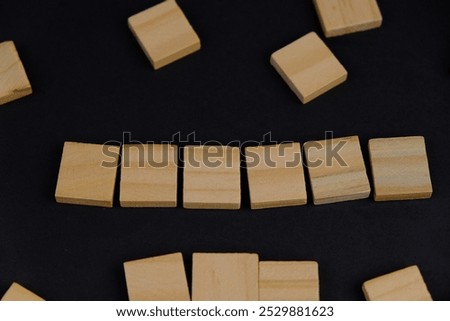 Similar – Image, Stock Photo Small wooden blocks with character icons and a gear shape around them