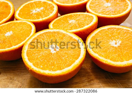 Fresh oranges cut set on wooden table