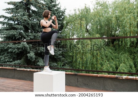 Similar – Image, Stock Photo Sportswoman jumping on terrace during training