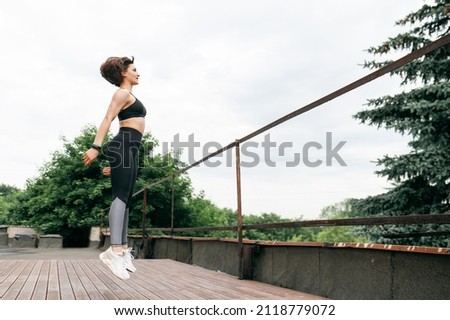 Similar – Image, Stock Photo Sportswoman jumping on terrace during training