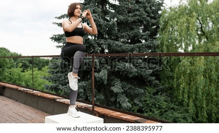 Similar – Image, Stock Photo Sportswoman jumping on terrace during training