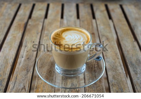 Hot coffee with crema in clear cup.