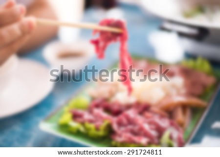 Blurred Thai food,fresh raw beef meat in restaurant.