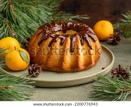 Similar – Foto Bild Orangefarbene Mandarinen in Keramik-Ornamentschale auf Holztisch