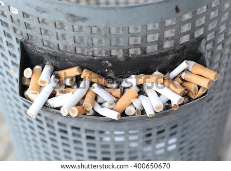 Smoked Cigarettes Butts in a Dirty Ashtray Big Bin Stock fotó © 