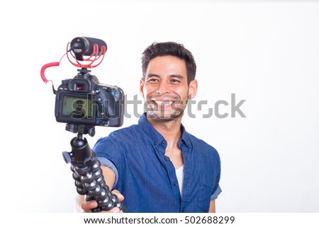 Similar – Image, Stock Photo Young man recording himself while playing guitar and singing to share the video in social media. Musician recording a music video at home.