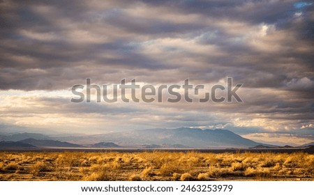 Image, Stock Photo Spacious field with dry grass and hills behind