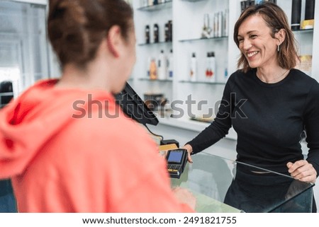 Similar – Image, Stock Photo Young Caucasian business woman with long brunette hair working on laptop in cafe. College student using technology