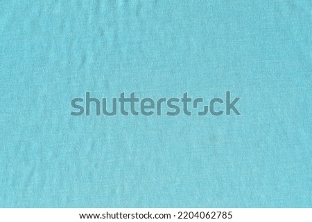 The texture of soft knitted cotton fabric is blue. An old tattered napkin. Photo stock © 