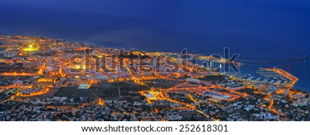 View of seaside part of Denia and sea port in night. Spain