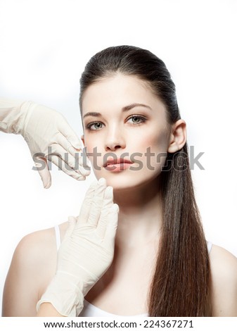 closeup portrait of attractive  caucasian  woman brunette isolated on white studio shot lips  face hair head and shoulders looking at camera gloves therapy